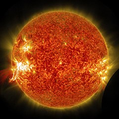 Eruption of a solar flare and a lunar transit