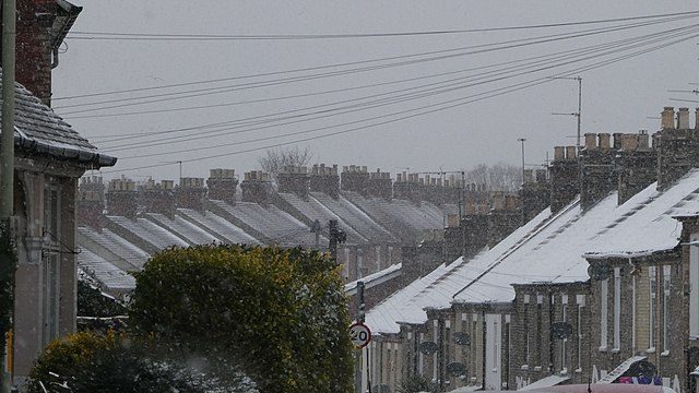 Snow on rooves over norwich. UK. Photo